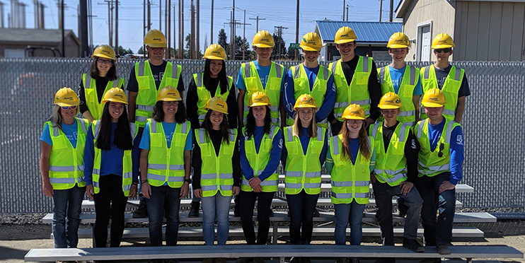 Group of Energy Pathways students in safety gear smiling