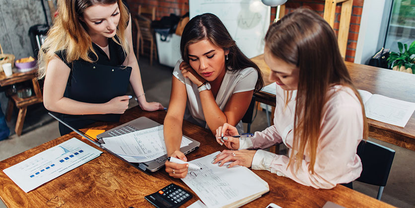 Women looking at finances together
