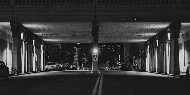 Black and white photo of a bridge in downtown, Spokane, and the street