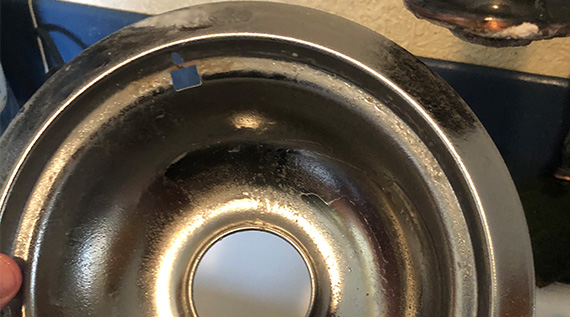 Shiny oven burner after it has been cleaned