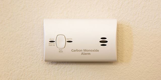 Carbon monoxide detector on tan wall