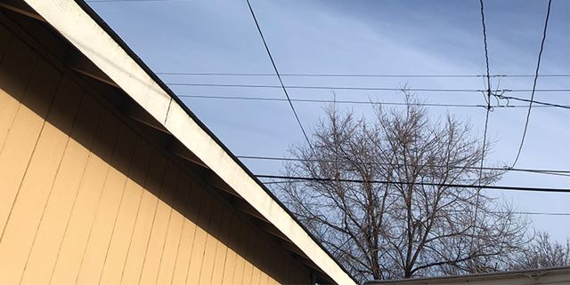 Overhead lines by a home's roof