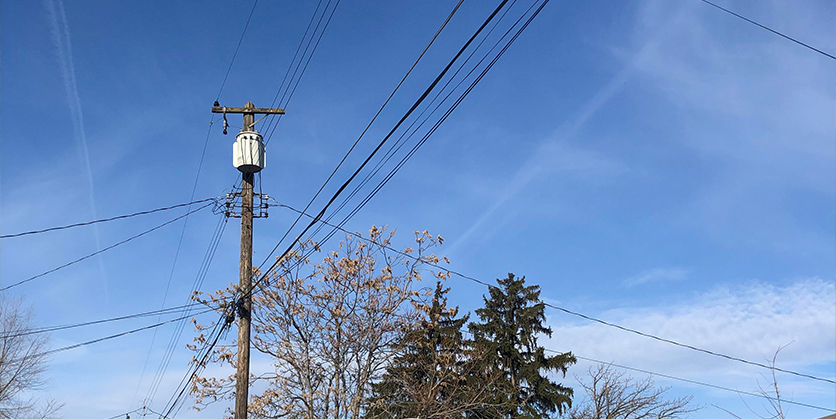 Power lines with blue sky in the background