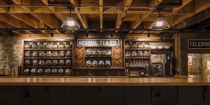 Revival Tea tasting room showing a sign Alycia, an artist, created
