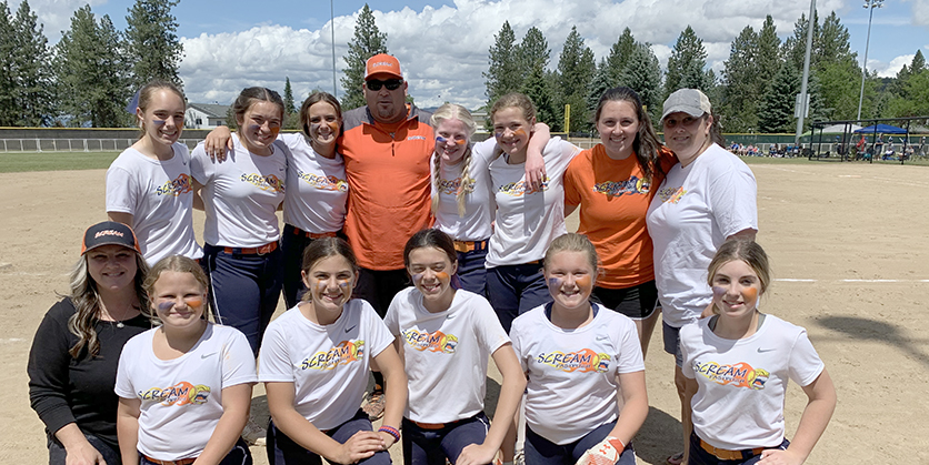 Scream 12U fastpitch team with coach