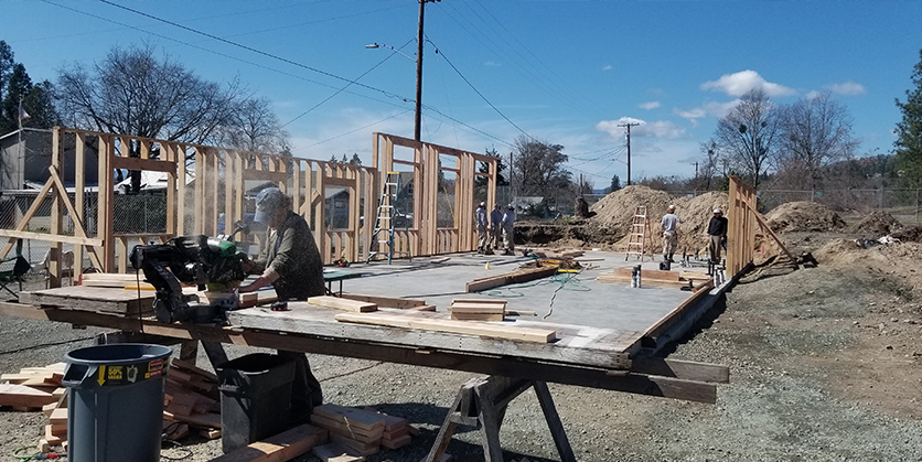 People building a house