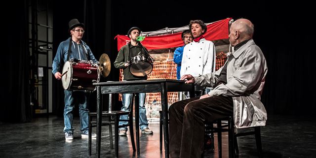 Five actors on stage at a community theater