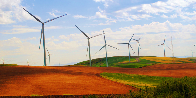 Windmills in front of a cloudy blue sky at Palouse Wind