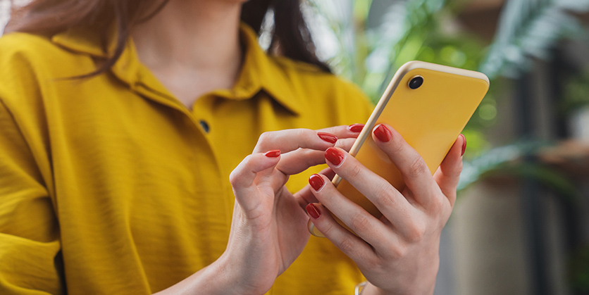 Closeup of a woman holding her smartphone