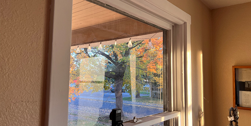 Closeup of a window with window plastic to help with drafts
