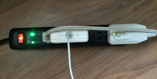 Smart power strip with devices plugged in