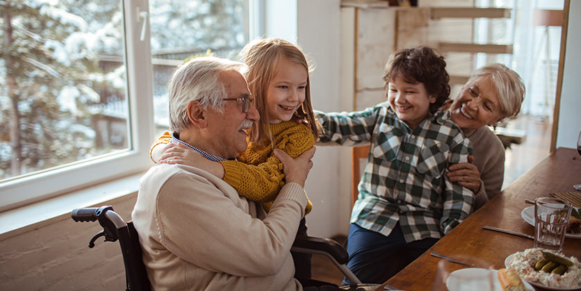 Family enjoying a meal together indoors on a snowy day