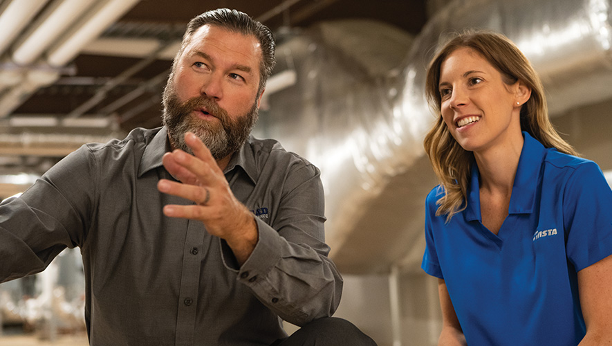 Man conferring with an Avista energy efficiency program manager