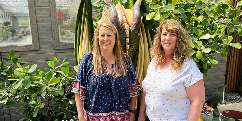 Two women stand in the Ritters greenhouse in Spokane, WA