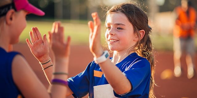 Children giving each other high fives