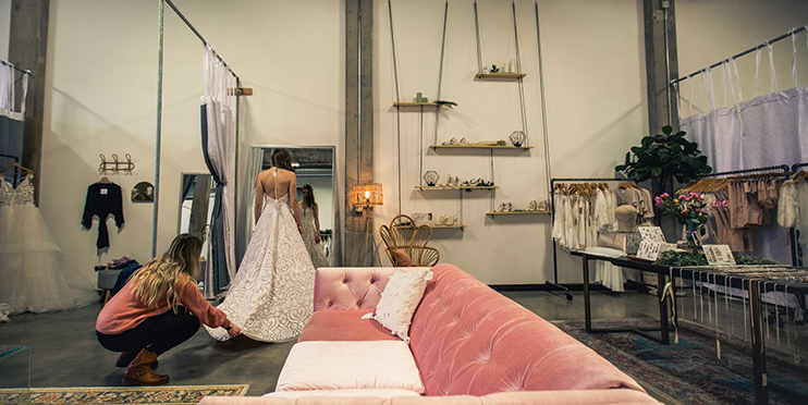 Woman trying on wedding dress