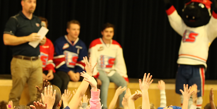 Children raising hands