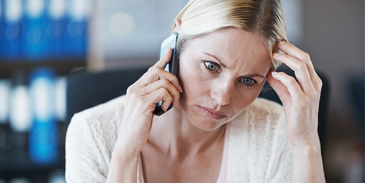 Concerned woman on phone
