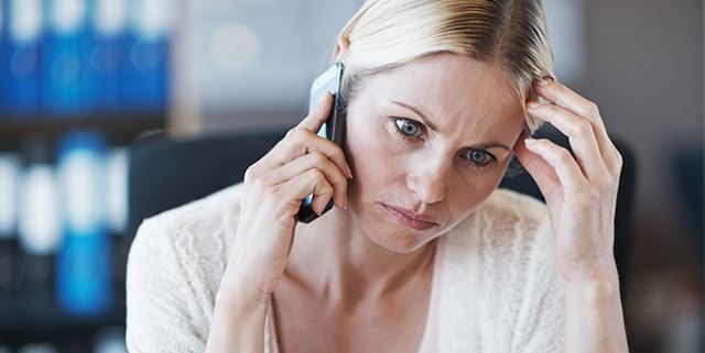 Concerned woman on phone