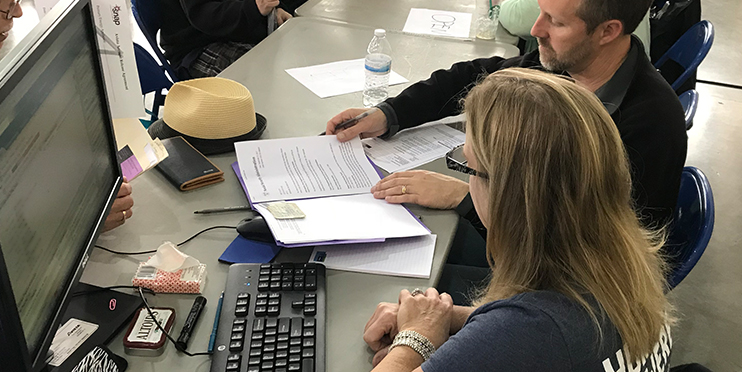 Man and woman looking at papers
