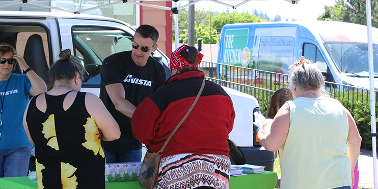 People at Avista's energy resource van