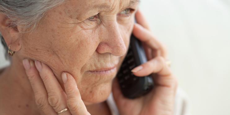 Concerned woman on phone