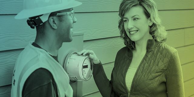 Woman smiling by smart meter
