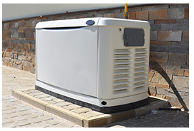 Natural gas generator installed outside next to a brick building