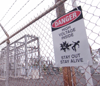 Chain link fence with Danger sign
