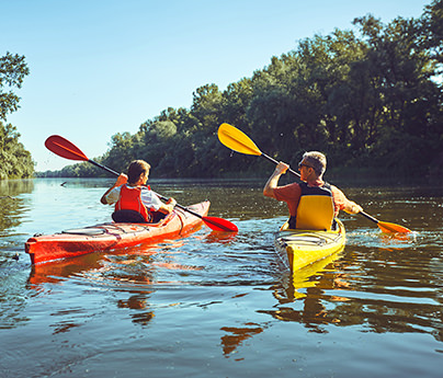 Two people kayaking on a river