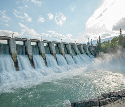 Water rushes through hydroelectric dam.