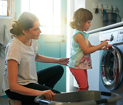 Mom and daughter doing laundry