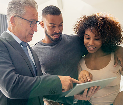 Couple looking at tablet while man points at it